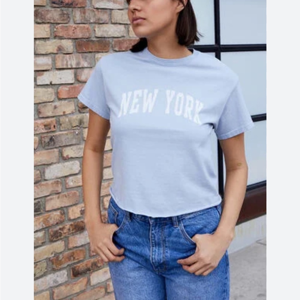 Brandy Melville light blue raw hem New York tee